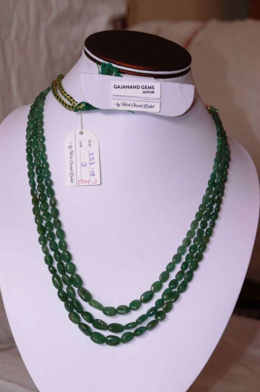 An image of 3 line Zambian Emerald Necklace (Oval Emerald Beads) or Panna Maniya Mala