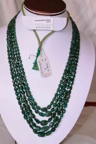 An image of 5 strings Emerald Gemstone Necklace (Oval Beads of Zambian Emeralds) or Zambian Panna Maniya Mala