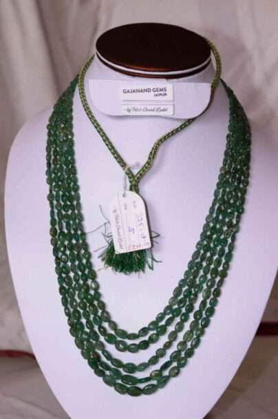 An image of 5 line Zambian Emerald Necklace (Oval Emerald Beads) or Panna Maniya Mala